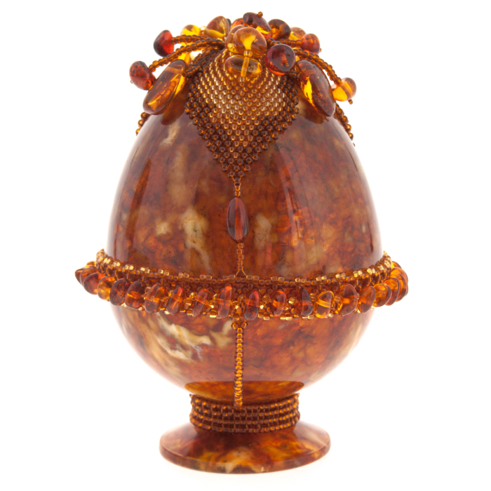 Яйцо пасхальное из янтаря с цветком-навершием