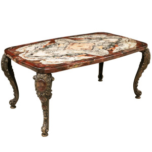 A table made of a cut of natural jasper with curly bronze legs. Collector's sample