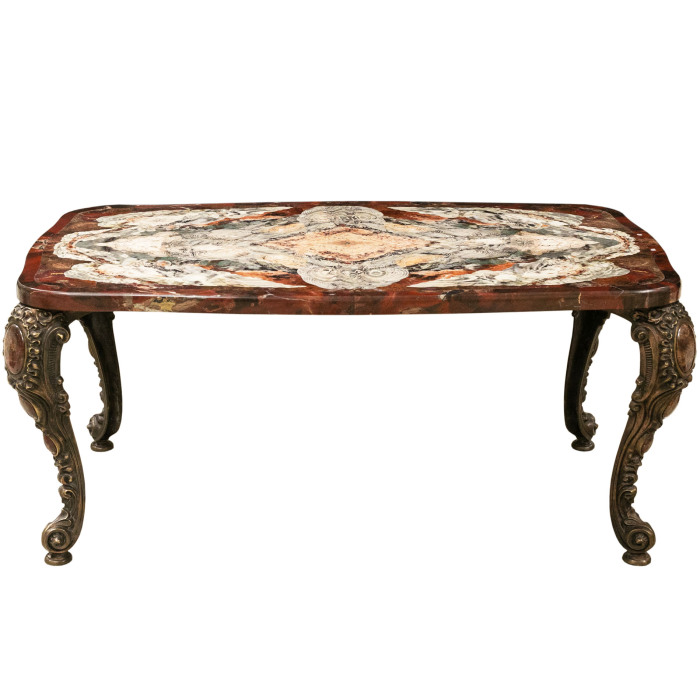 A table made of a cut of natural jasper with curly bronze legs. Collector's sample
