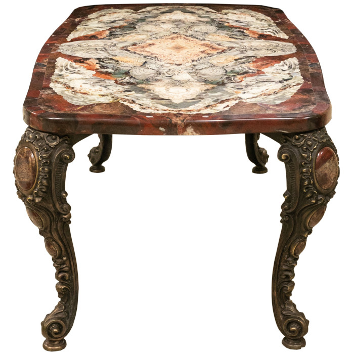 A table made of a cut of natural jasper with curly bronze legs. Collector's sample