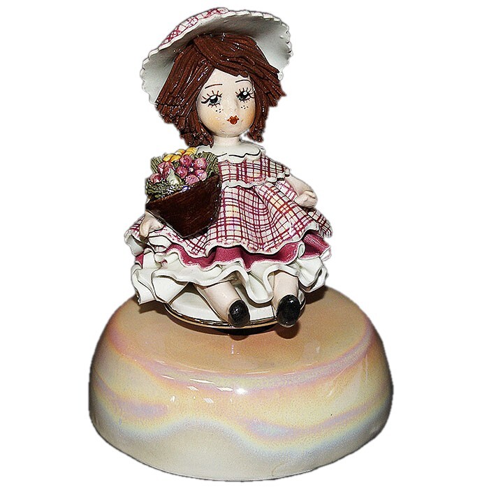 Musical statuette "Doll with flowers"