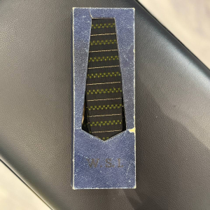 A tie with an inscription and an autograph of the musician Viktor Tsoi